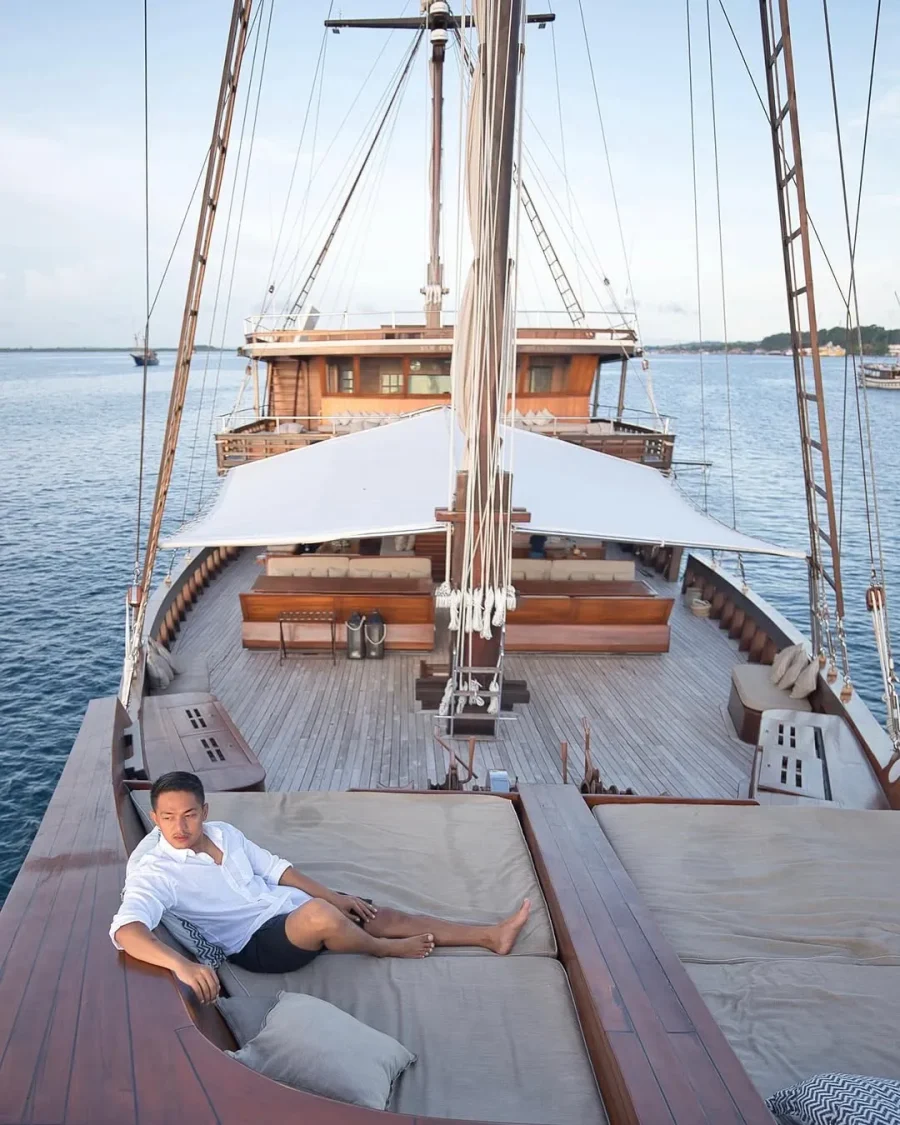 Agung Afif on the deck of a phinisi yacht